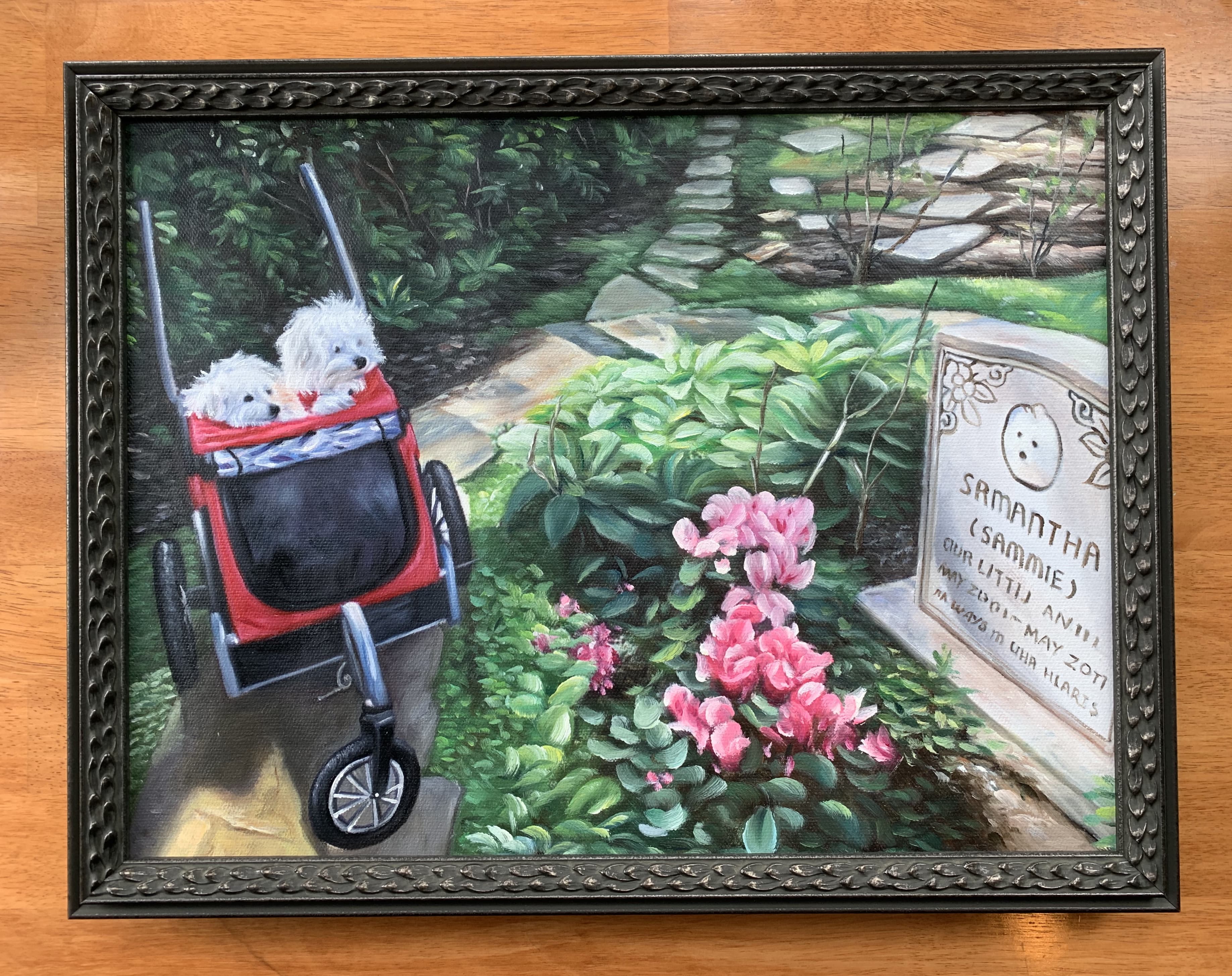 A framed oil painting showing two small fluffy white dogs in a stroller, gazing at the tombstone of the dog from which they were cloned.