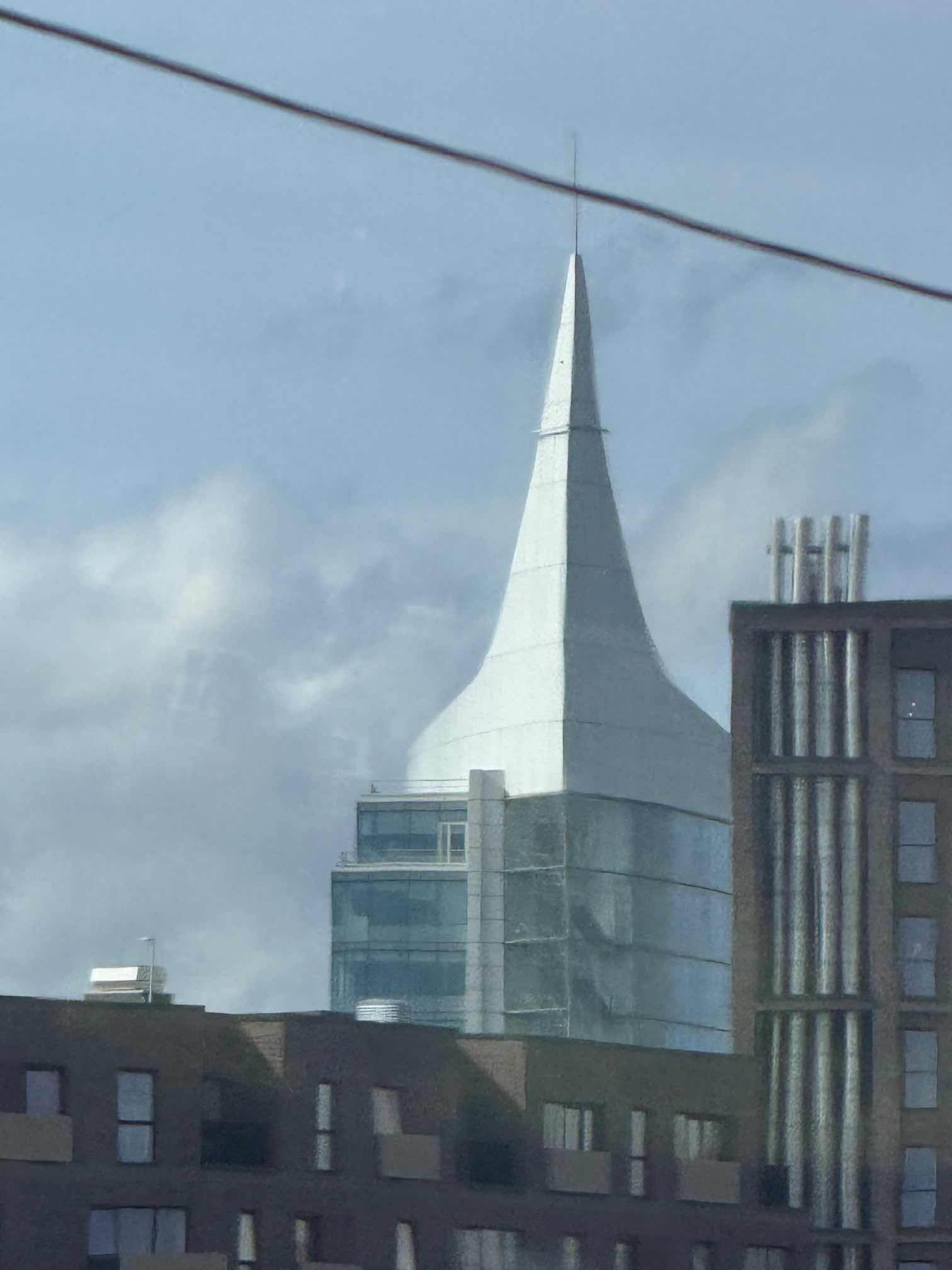not a great photo of a building with a distinctive shaped roof
