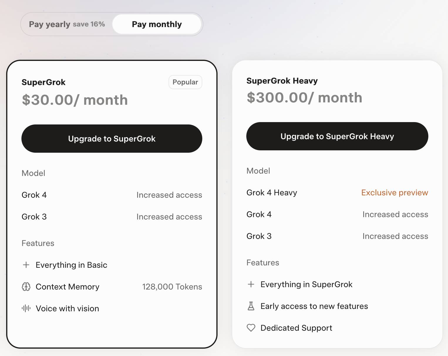 Screenshot of subscription pricing page showing two plans: SuperGrok at $30.00/month (marked as Popular) with Grok 4 and Grok 3 increased access, features including Everything in Basic, Context Memory 128,000 Tokens, and Voice with vision; SuperGrok Heavy at $300.00/month with Grok 4 Heavy exclusive preview, Grok 4 and Grok 3 increased access, features including Everything in SuperGrok, Early access to new features, and Dedicated Support. Toggle at top shows "Pay yearly save 16%" and "Pay monthly" options with Pay monthly selected.